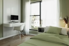 MarPlus 2 Teilansicht zweites Schlafzimmer mit Arbeitsbereich und Bett im Vordergrund